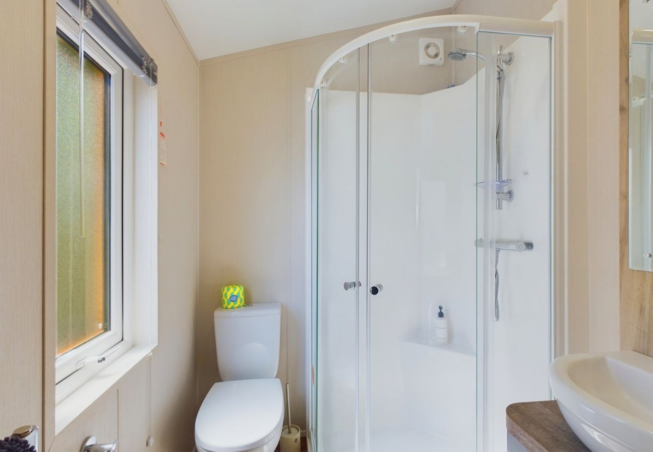 Holiday Lodge En-suite shower room with basin and WC.