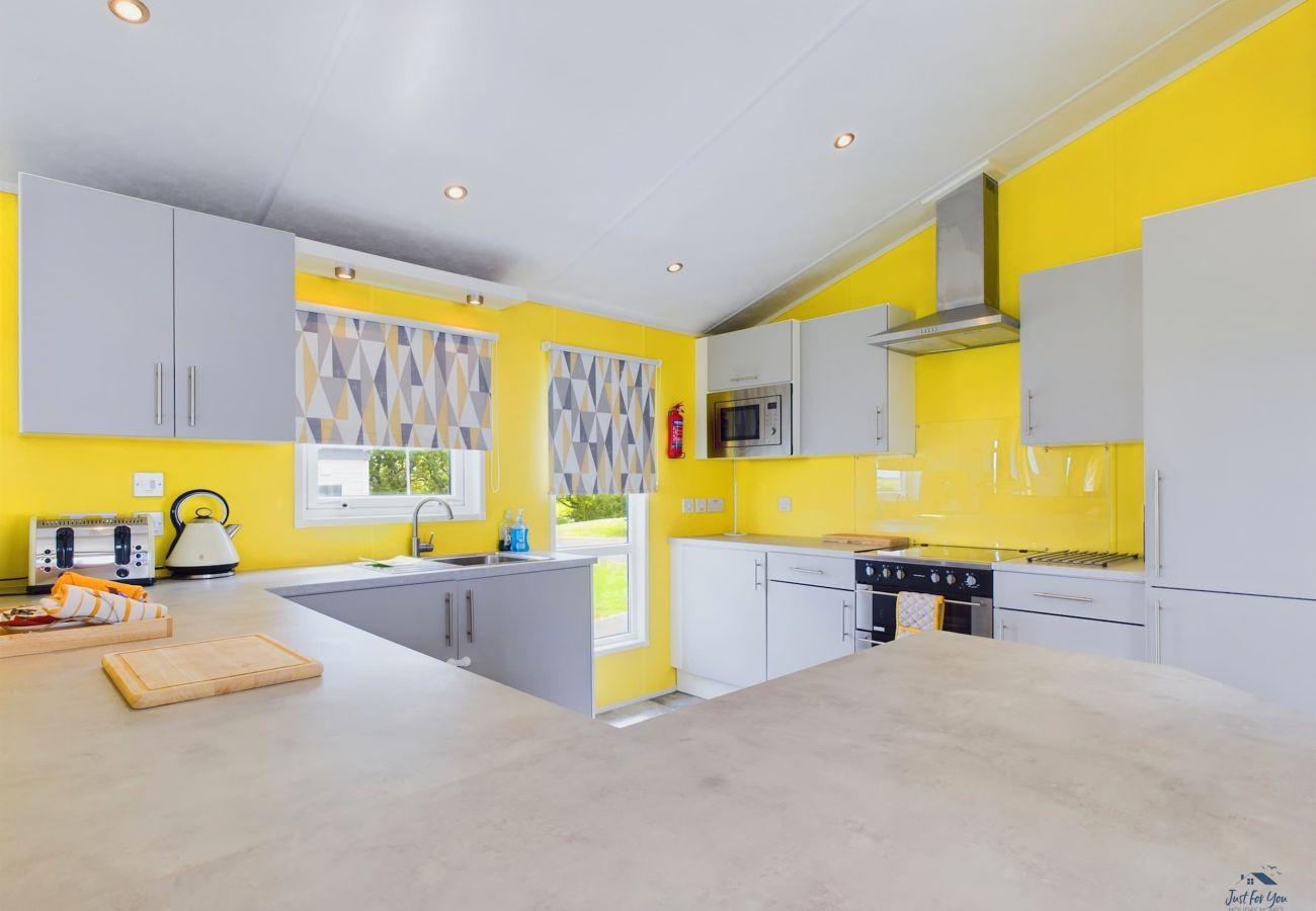 Modern kitchen in a family holiday lodge on the Isle of Wight, close to beaches with countryside views. Sleeps 4 guests