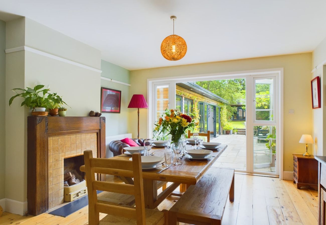 Open-plan kitchen and dining area  with french doors out to the garden at a luxury coastal retreat on the Isle of Wight